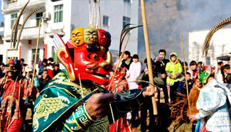 Folk artists perform Nuo dance to greet Chinese Lunar New Year in E China